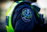 A SA Police officer's shoulder badge.