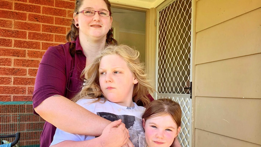 Felix and Amelia with their mother Chloe, who has home-schooled Felix for the past three years.