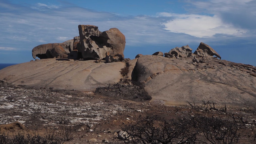 Remarkable Rocks formation with burnt black ground surrounding it