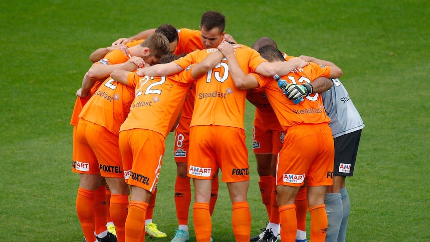 Brisbane Roar in a huddle before round two A-League game against Perth Glory in October 2014