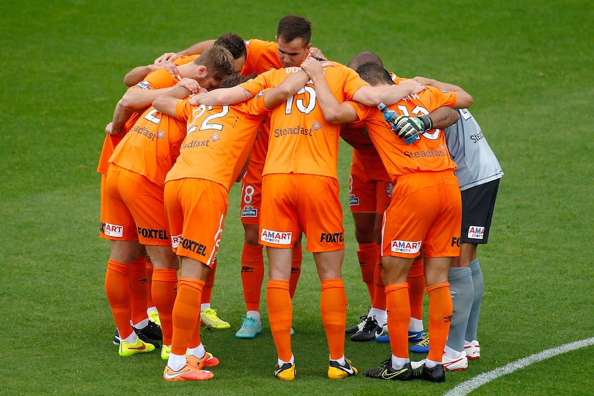 Brisbane Roar in a huddle before round two A-League game against Perth Glory in October 2014
