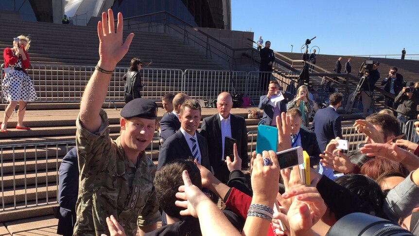 Prince Harry waves to the big crowd that gathered at Sydney Opera House