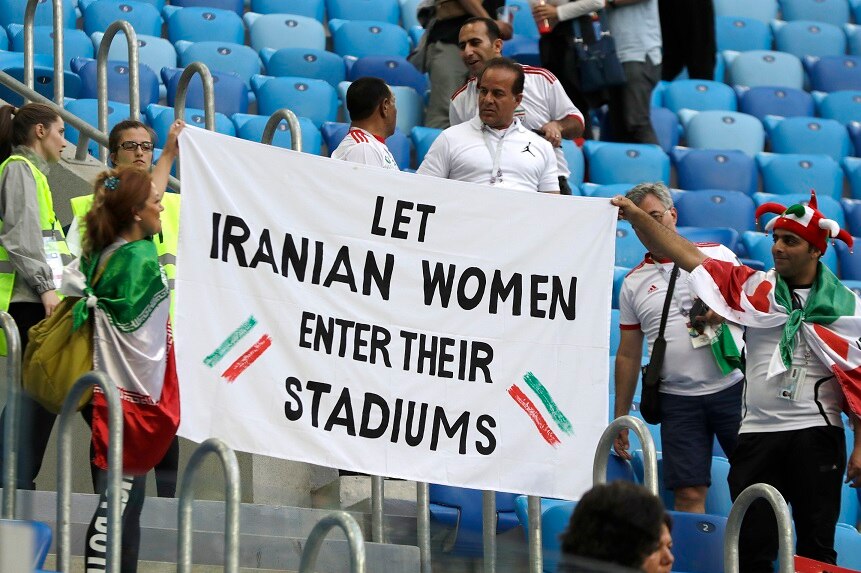 People supporting Iranian women are holding a banner at the stands during the Group B match between Morocco and Iran.