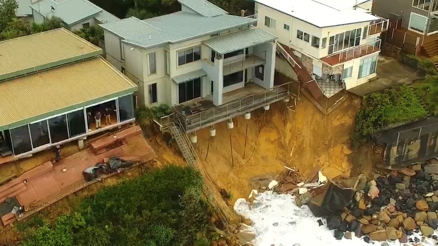 Houses teetering on the edge of collapse after east coast low lashed the Wamberal beach front in July 2020.