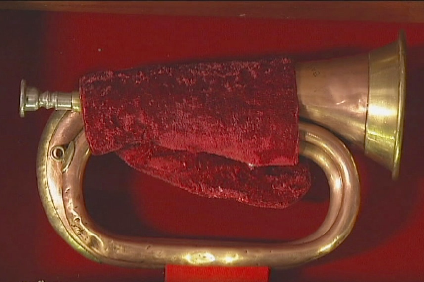 A red cloth is wrapped around the WW1 bugle displayed in a Tasmanian RSL club
