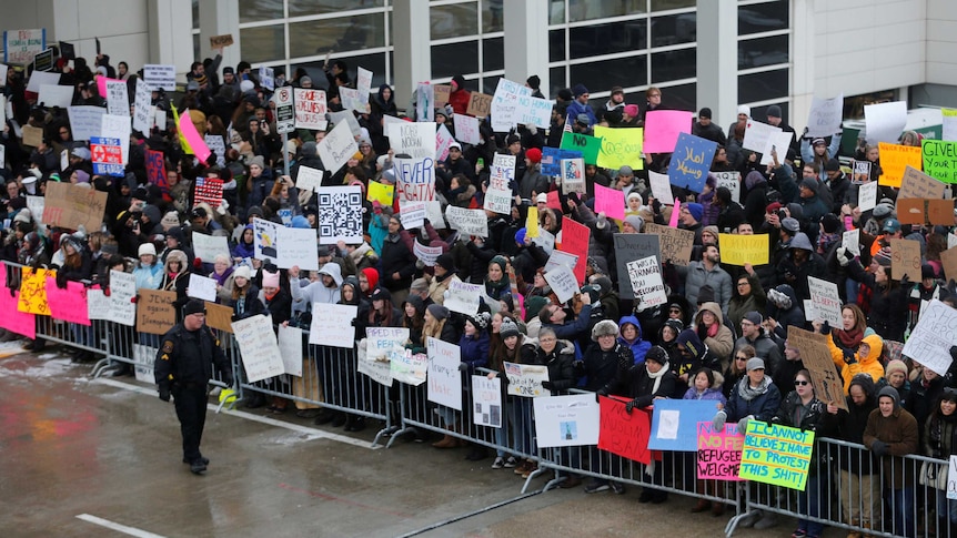 Hundreds rally against travel ban at Detroit airport