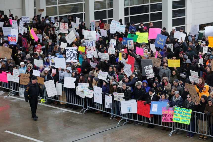 Hundreds rally against travel ban at Detroit airport