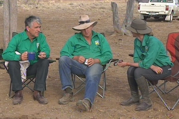 Stock Up for Hope patron and former deputy prime minister John Anderson shares a cuppa with other volunteers.