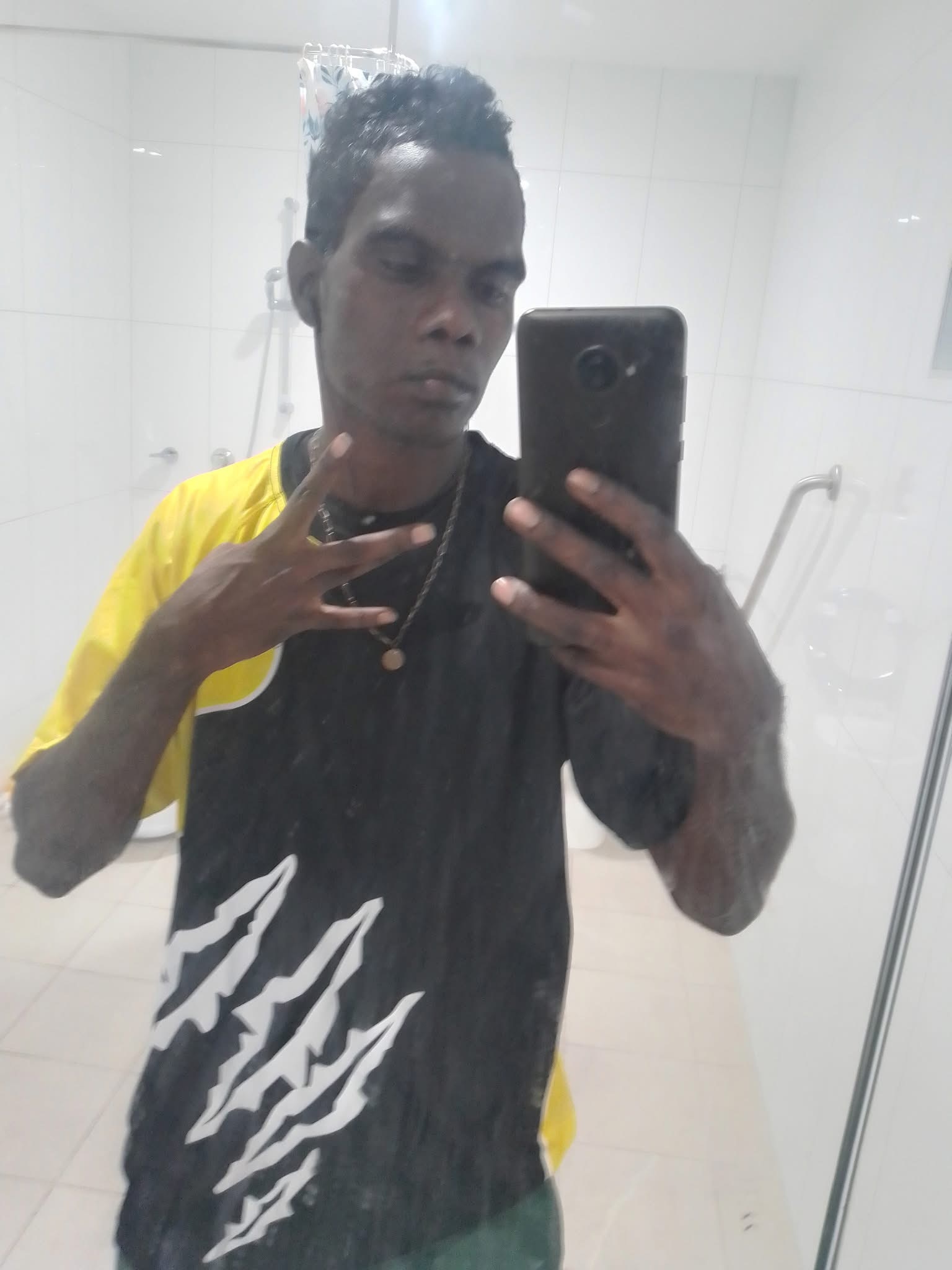 A mirror selfie of a man wearing sunglasses.