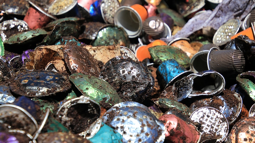 A pile of squashed coffee pods in a bin at Nowra.