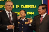 Scott Morrison celebrates with Cambodia's interior minister