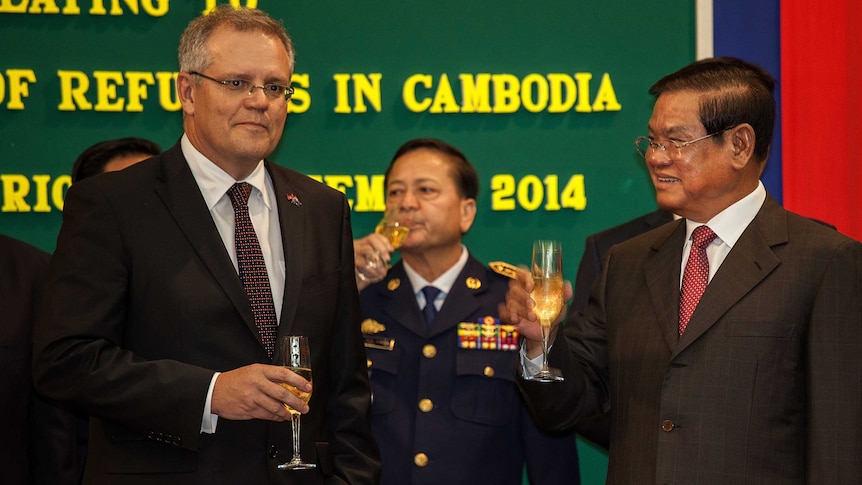 Scott Morrison celebrates with Cambodia's interior minister