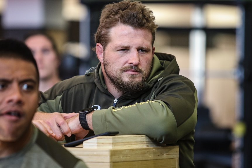 A close up of Wallabies prop James Slipper in a leaning pose and looking pensive