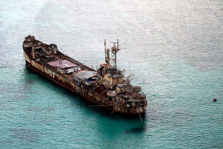 A ship wreck is seen from above. 