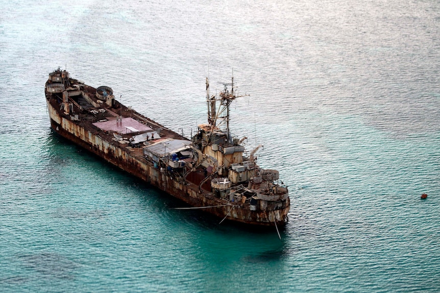 A ship wreck is seen from above. 