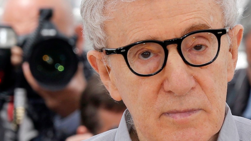 A close-up of Woody Allen wearing black-rimmed glasses.