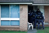 NSW Police raid a home in Auburn during raids targeting bikies, 27th April 2012.