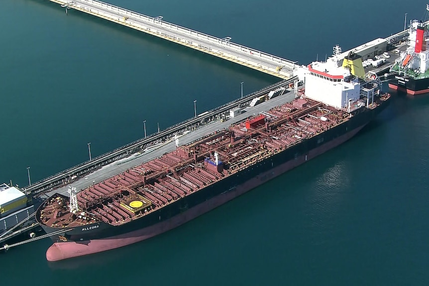 An aerial shot of a freight ship docked at Kwinana Bulk Jetty.