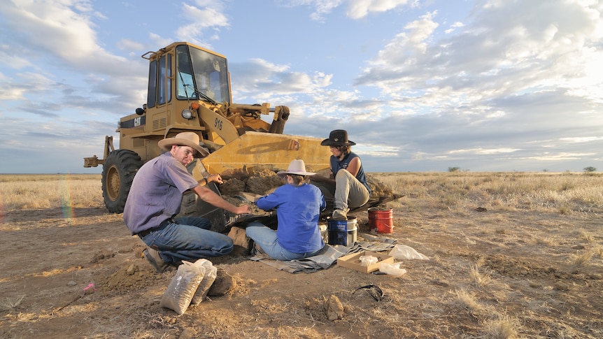 A group of volunteers and researchers on a dig site near Winton