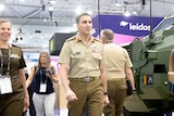 Chief of Army, Lieutenant General Simon Stuart tours the convention floor at Land Forces 2022 in Brisbane, QLD.
