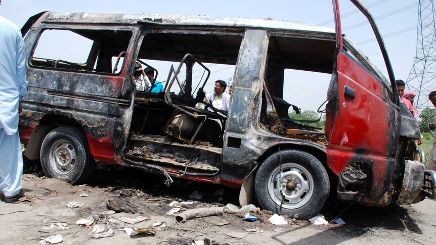 Burnt-out Pakistan school van