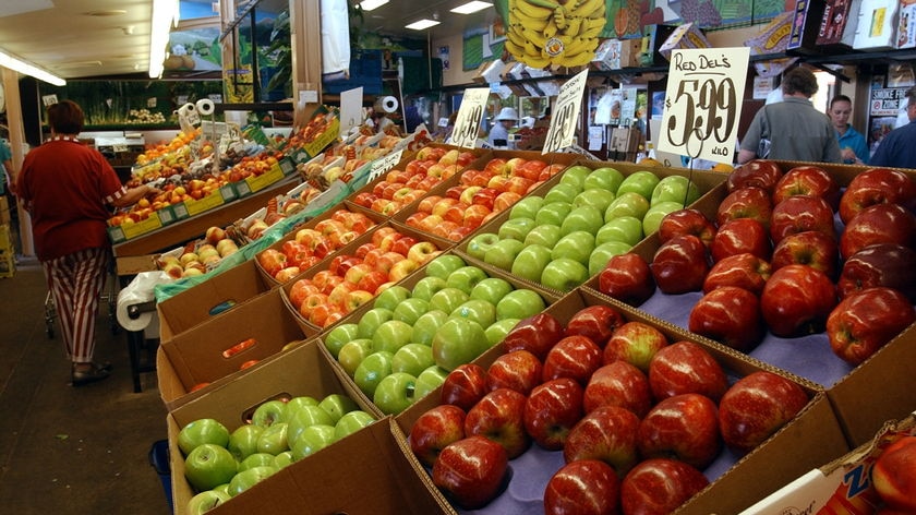 A crate of apples on display at a market