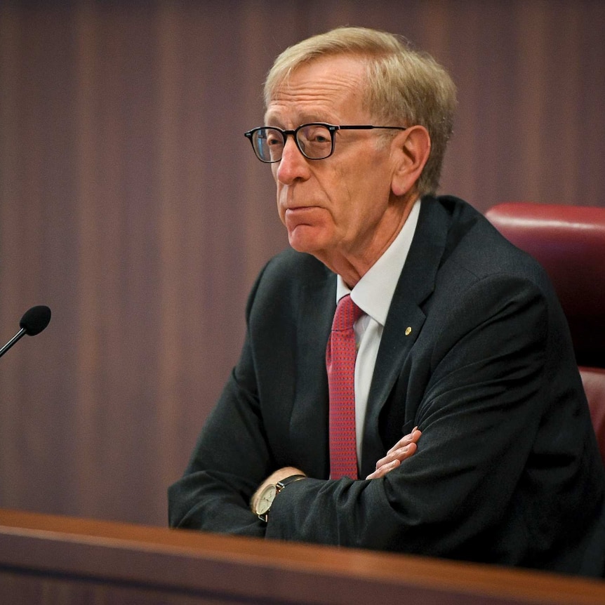 The Commissioner Kenneth Hayne presides over the hearing