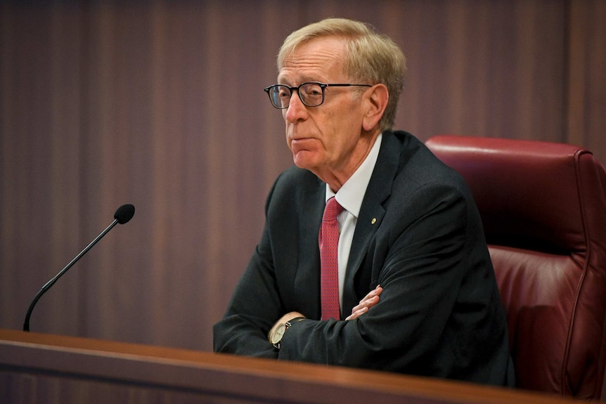 The Commissioner Kenneth Hayne presides over the hearing