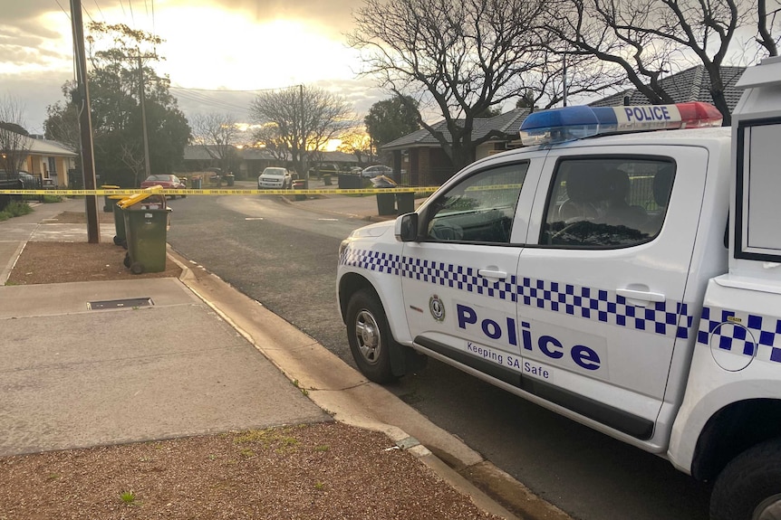 A police vehicle in front of crime scene tape on Roberts Crescent Smithfield Plains.