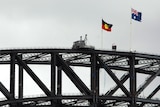 The Aboriginal and Australian flags fly above Sydney Harbour Bridge back in February when the PM apologised to indigenous Australians (file photo).
