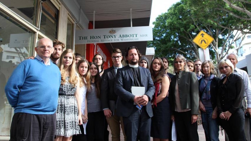 Christian activists stand outside Prime Minister Tony Abbott's Sydney office.