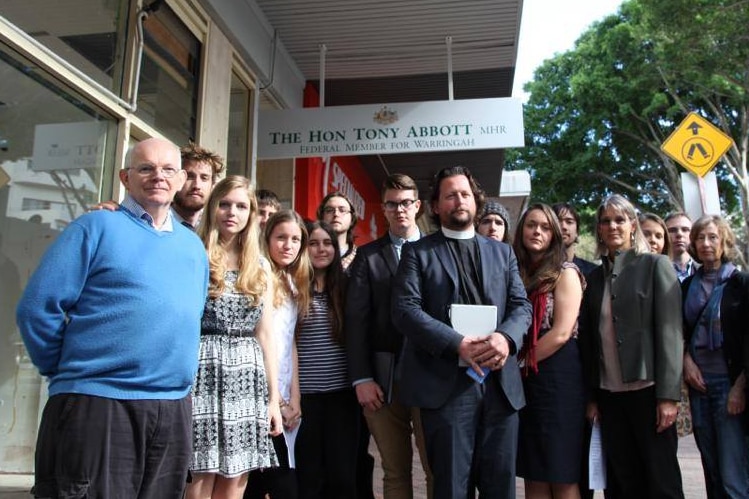 Christian activists stand outside Prime Minister Tony Abbott's Sydney office.