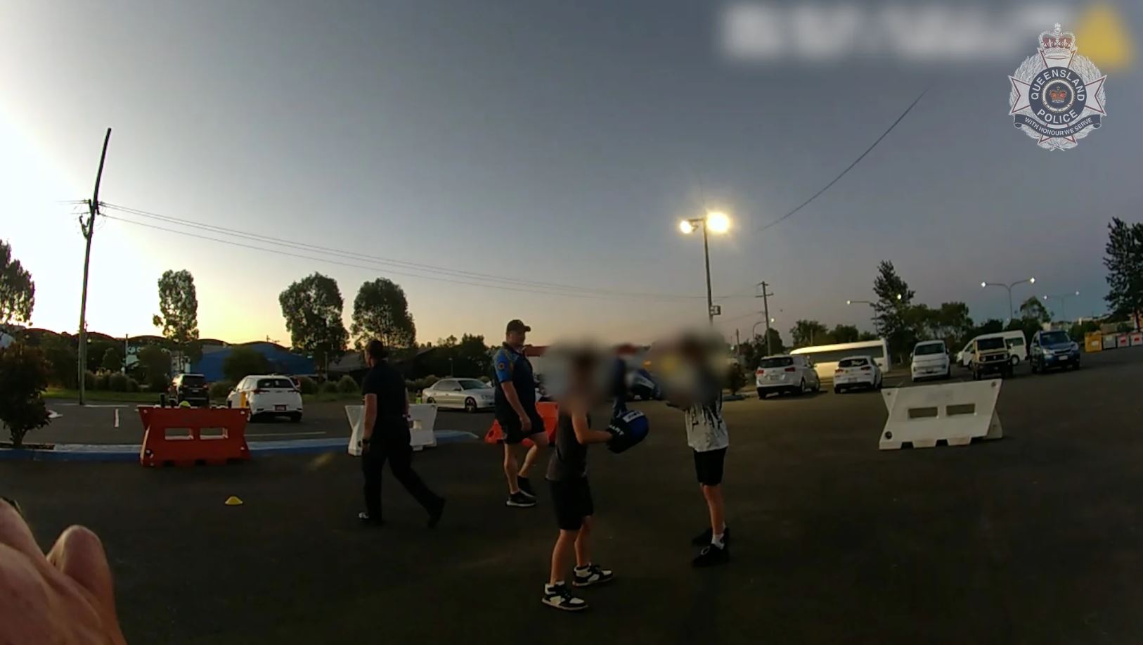 A police image of young people boxing