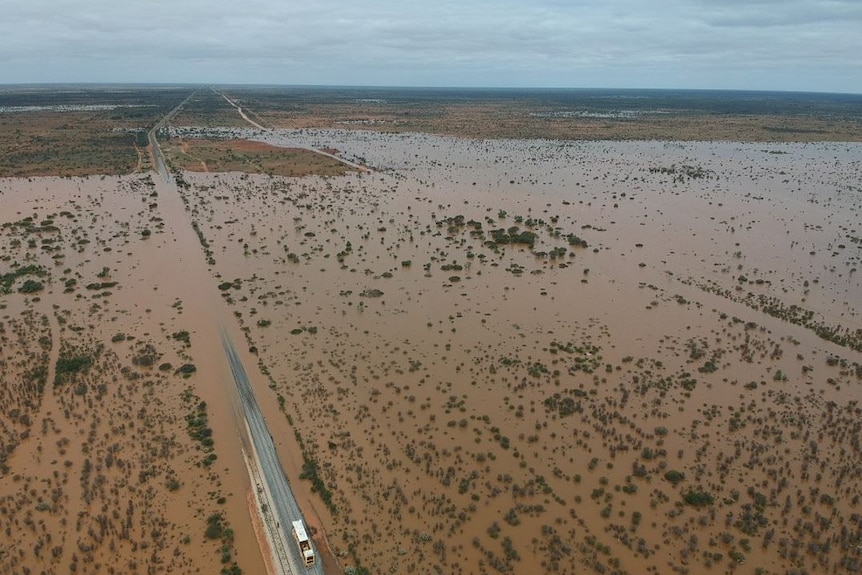 Flooding in the outback cuts a railway line.  