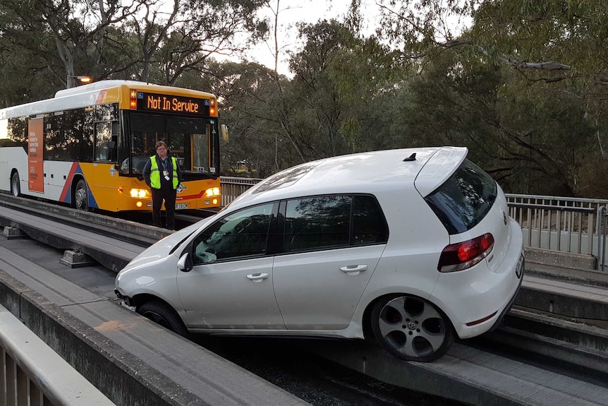 A car stuck on the Adelaide O-Bahn track
