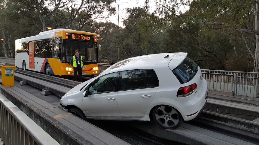 A car stuck on the Adelaide O-Bahn track