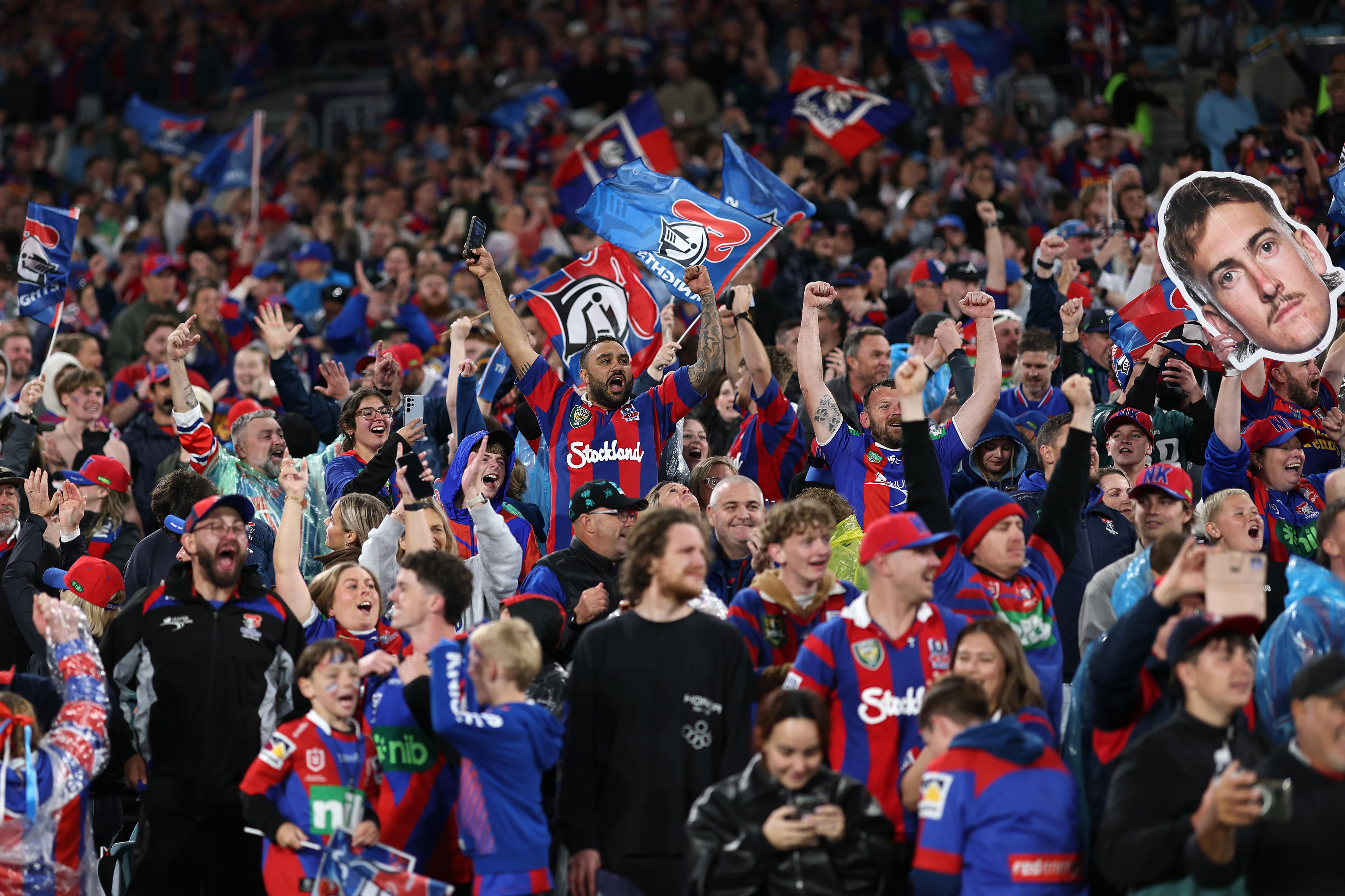 A group of rugby league fans celebrate a win