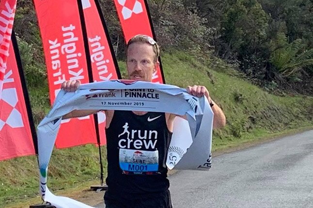 NSW runner Ben St Lawrence crosses the finish line