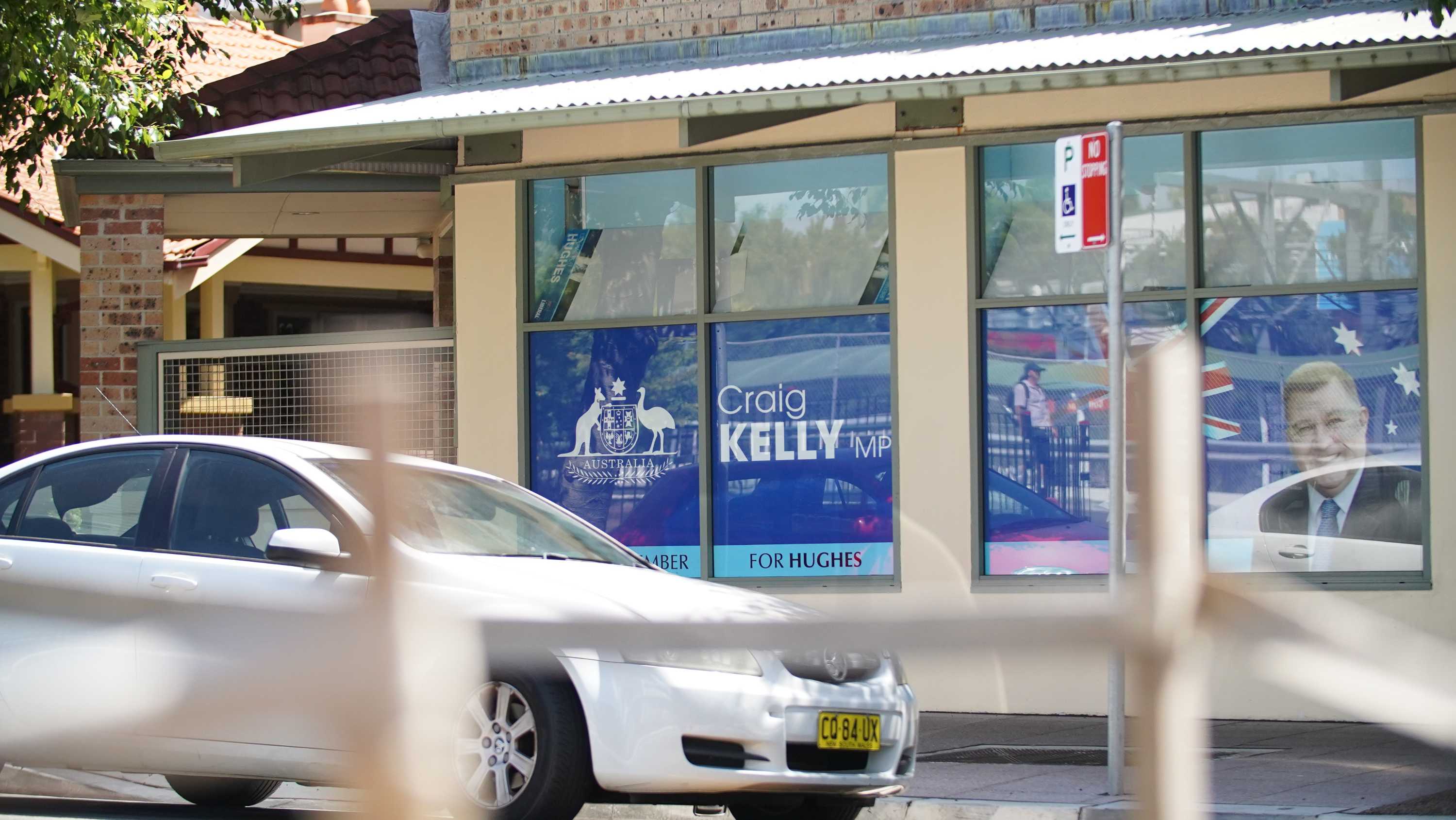 The front of an office with a sign that says Craig Kelly MP on the window.