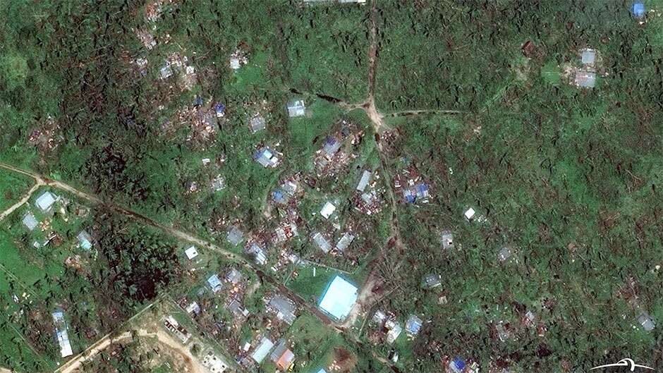 A suburb in Vanuatu's capital, Port Vila, lies in ruins after being hit by Cyclone Pam.