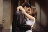 David Schwimmer and Jennifer Aniston embrace on the set of the NBC sitcom Friends