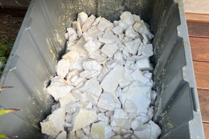 A large container of a white chalky substance.