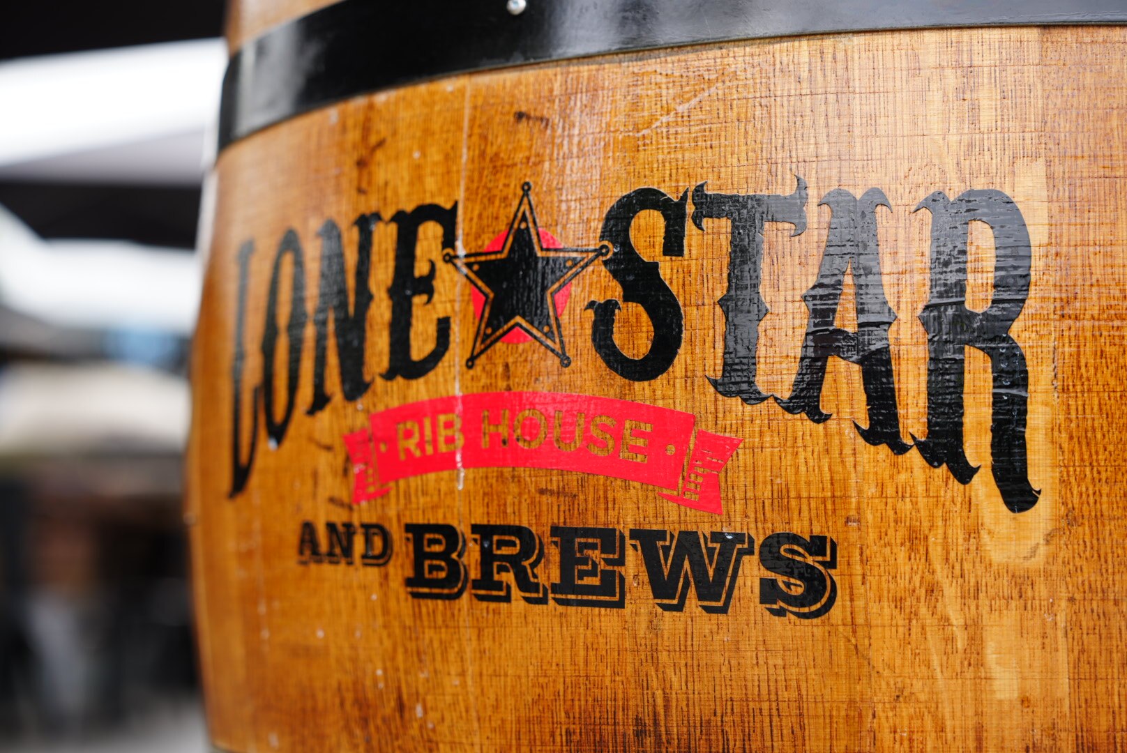 Images of Lone Star Rib House Brews Penrith's wooden exterior on a cloudy day
