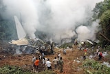 Rescuers search for survivors of a plane crash in southern India.