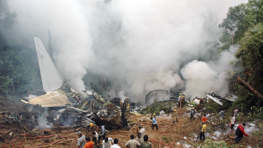 Rescuers search for survivors of a plane crash in southern India.