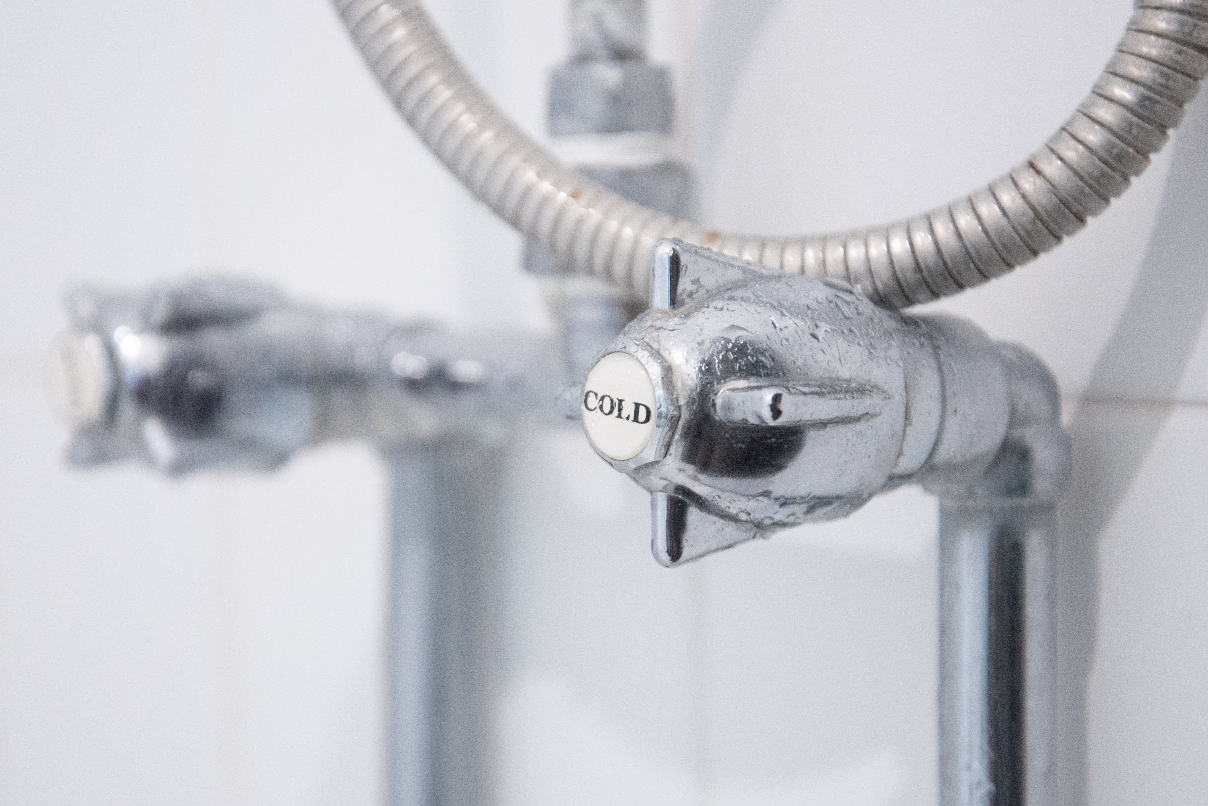 The cold tap in a shower.