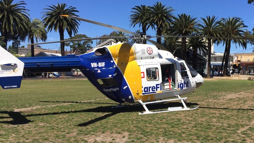 A Care Flight helicopter on the green near site of accident at Eastwood, north-east Sydney