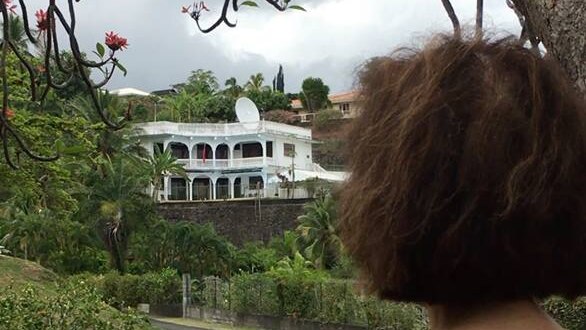 Residence Taina, which hosts the Chinese Consulate in French Polynesia. It is a white building with a big dish on top.