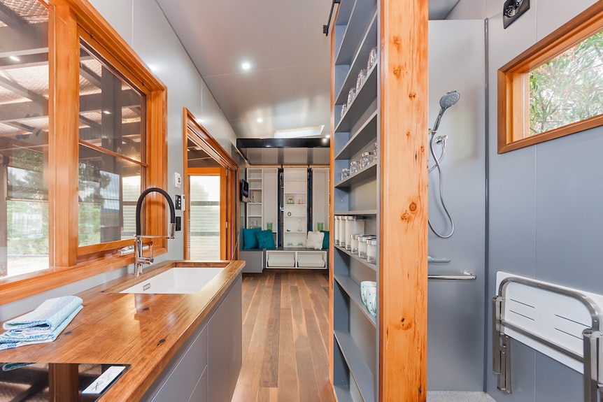 Tiny house kitchen and shower alcove