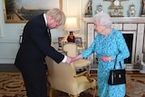 In an ornate room of Buckingham Palace, Queen Elizabeth II shakes the hand of Boris Johnson with a bowed head.